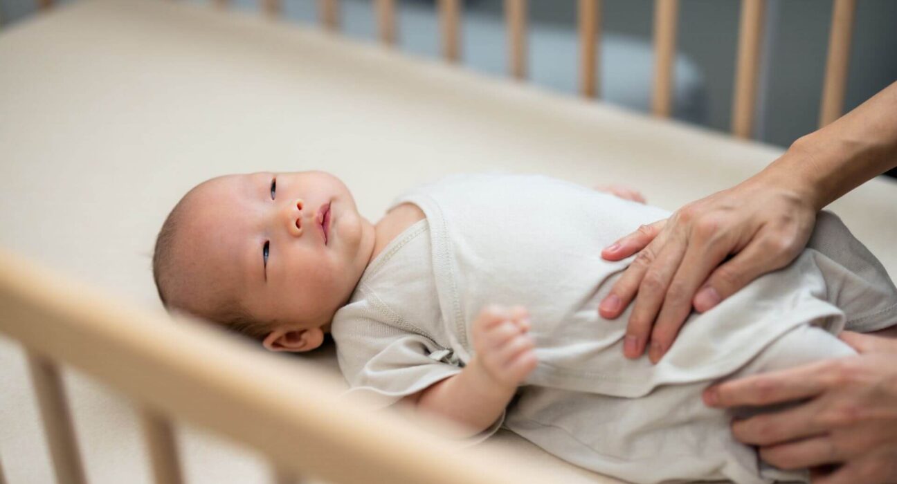 Baby mit Wickelbody